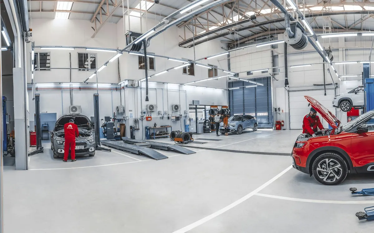 Modern garage with cars on lifts